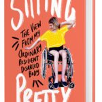 orange book cover of Sitting Pretty by Rebekah Taussig. Rebekah sits in her wheelchair, wearing a yellow shirt and black shorts.